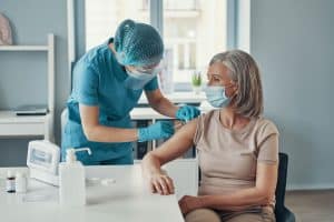 Nurse giving injection