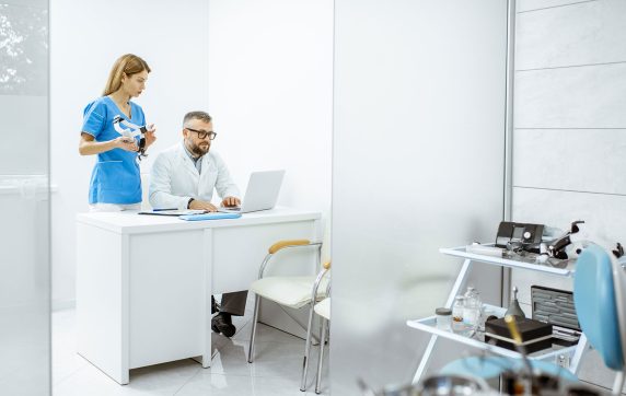 Two doctors working in office